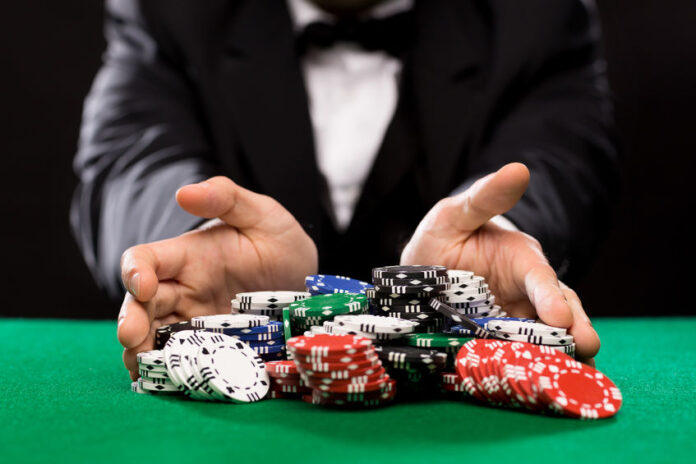 poker player with chips at casino table